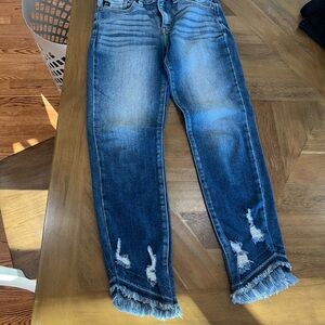 Distressed Blue Jeans with Frayed Hem